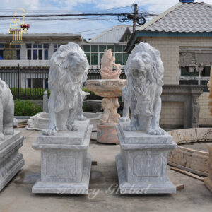 Hand carved white carrara marble lion at the entrance gate