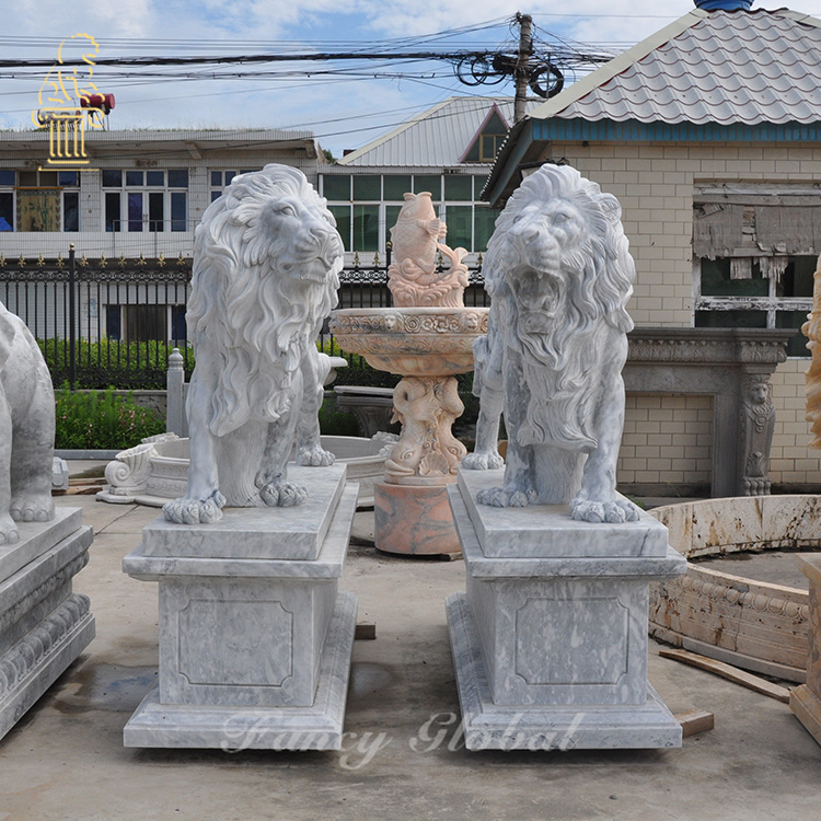 Hand carved white carrara marble lion at the entrance gate